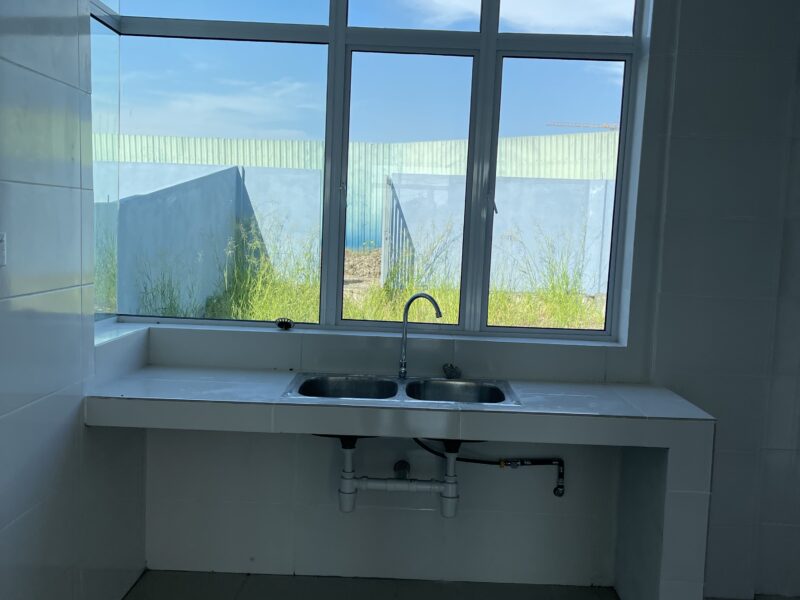 Kitang Heights two storey intermediate terrace house with sub-basement.