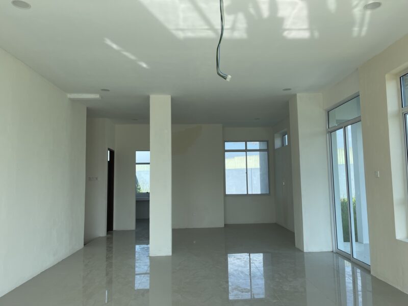 Kitang Heights two storey intermediate terrace house with sub-basement.